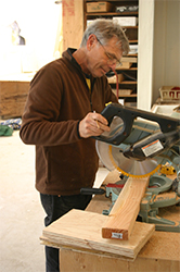 David working on the contstruction of work boards for the assembly of the ten-foot long sanctuary sidelights