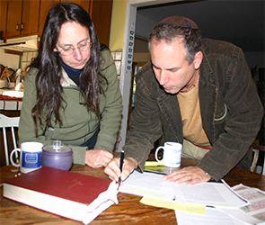 Rabbi George and artist Michelle Plachte-Zuieback confer on the design for the sanctuary sidelight window
