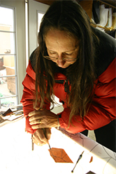 Michelle continues cutting glass for the first of the eight sanctuary sidelights