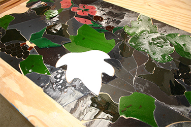 Pieces covered with resist in preparation for painting