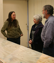 Sue Smith and her husband, Ed, discusses glass cutting with her
