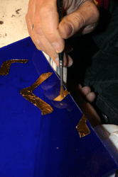 Sealing the gold leaf