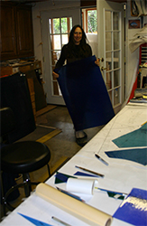 Michelle moves full sheet to cutting table
